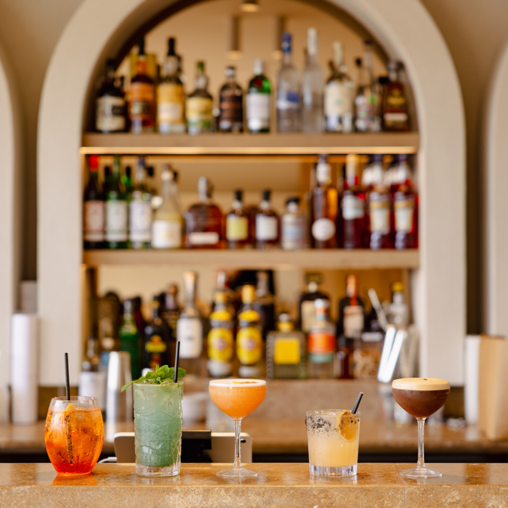Cocktails lined up at the rooftop bar in TotalFusion’s bathhouse
